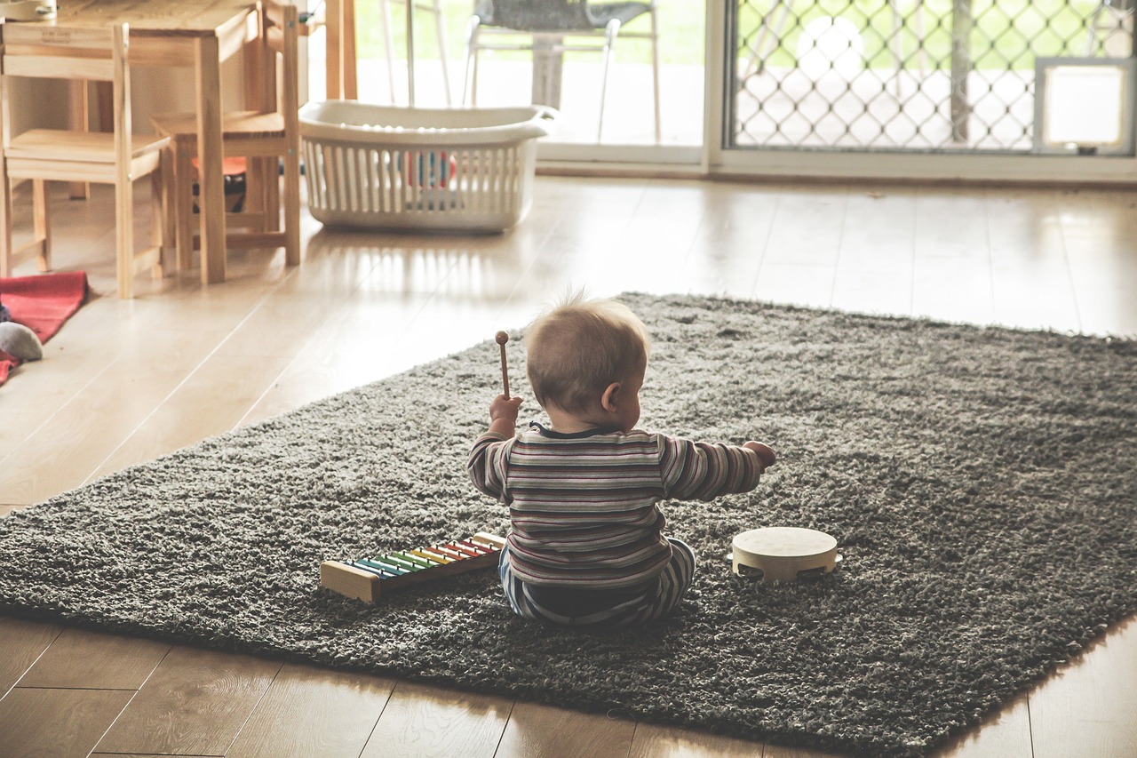 baby at home enjoying warmth of underfloor heating